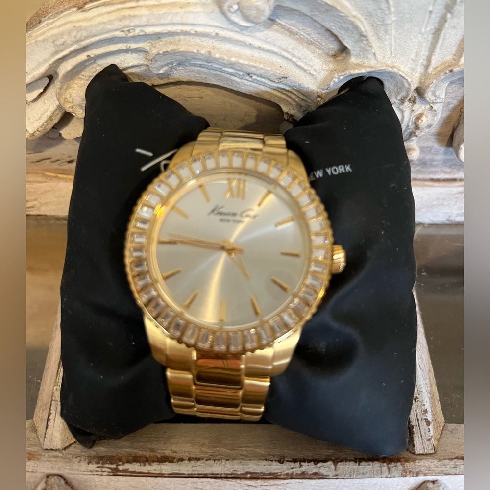 Kenneth Cole gold colored watch with cz stones